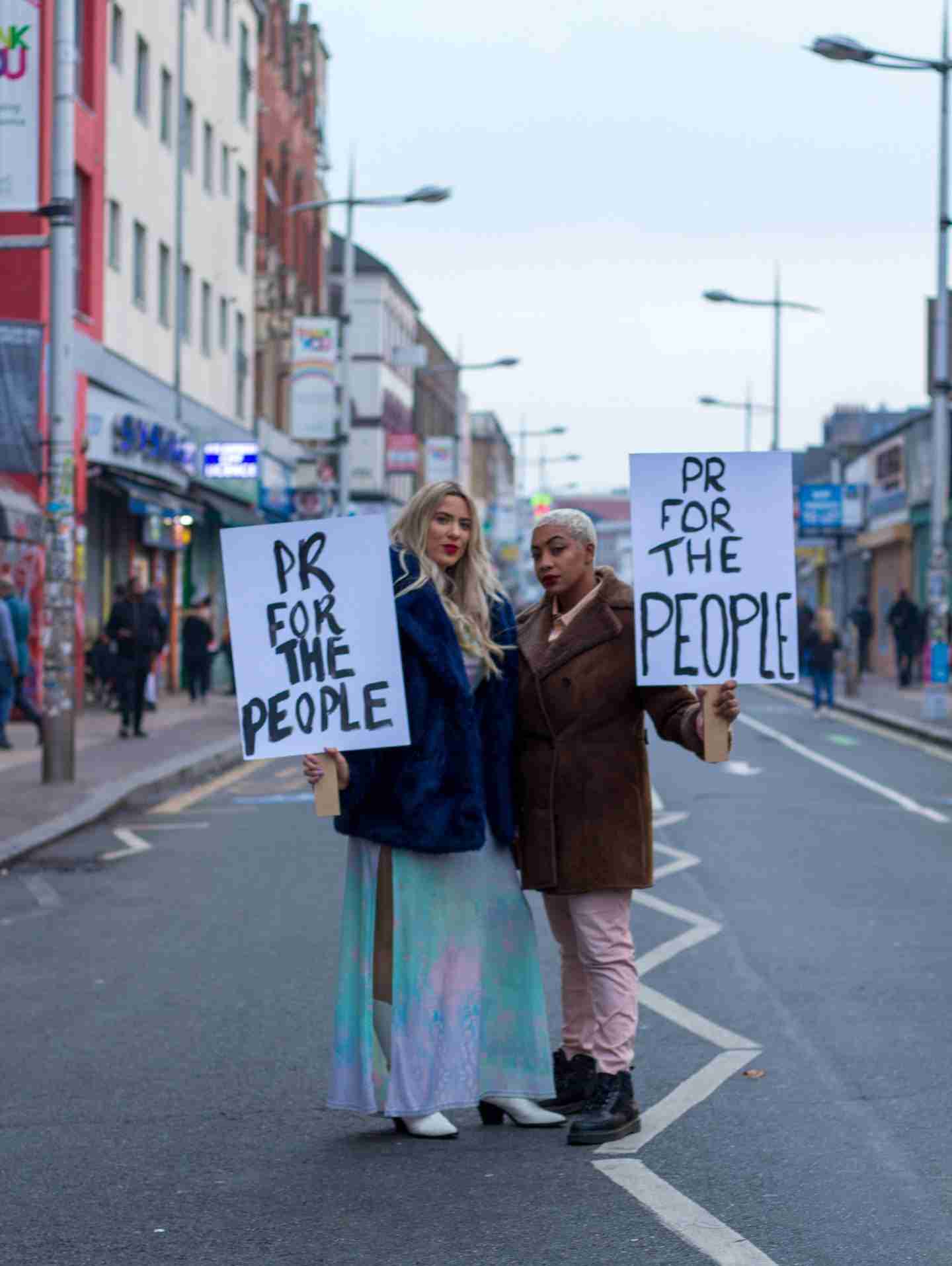 pr for the people with banners in street