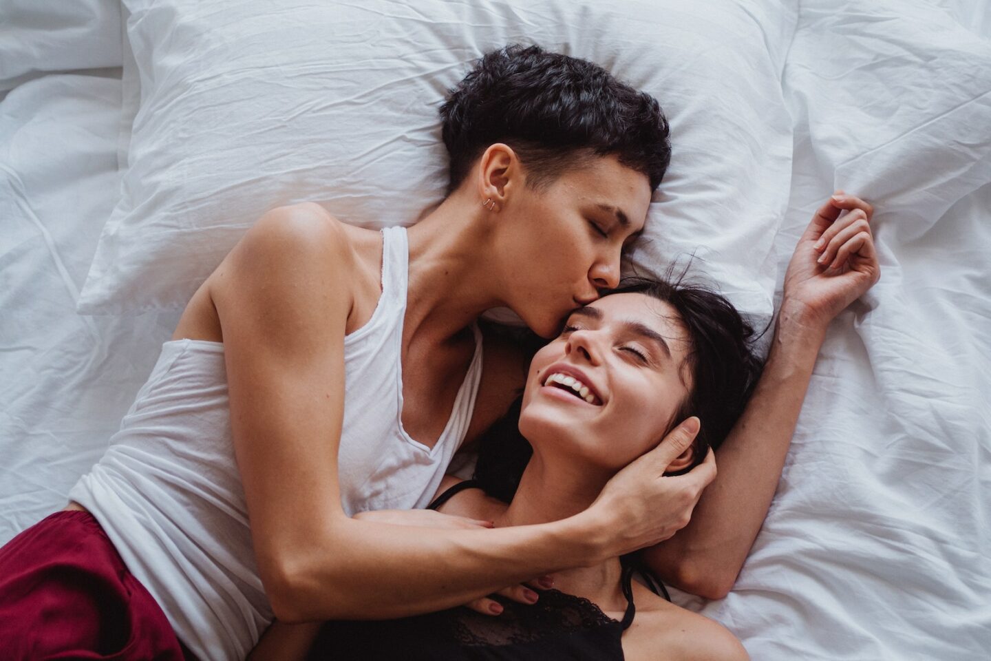 Woman Kissing Another Woman on the Forehead - prevent lesbian bed death