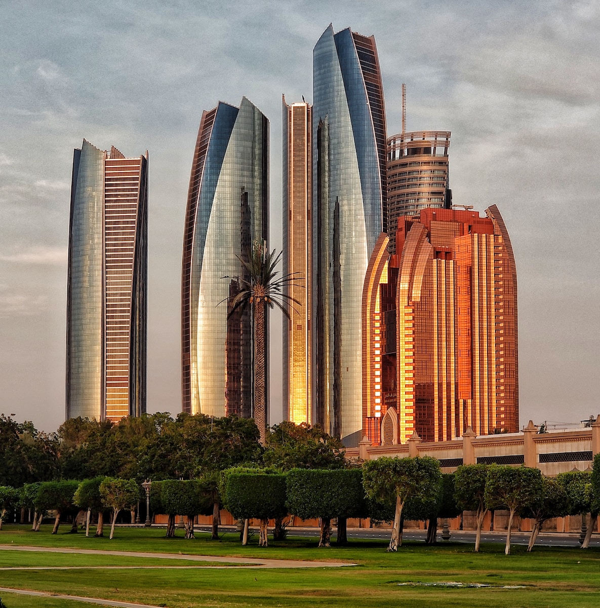 green grass field near high rise buildings during daytime