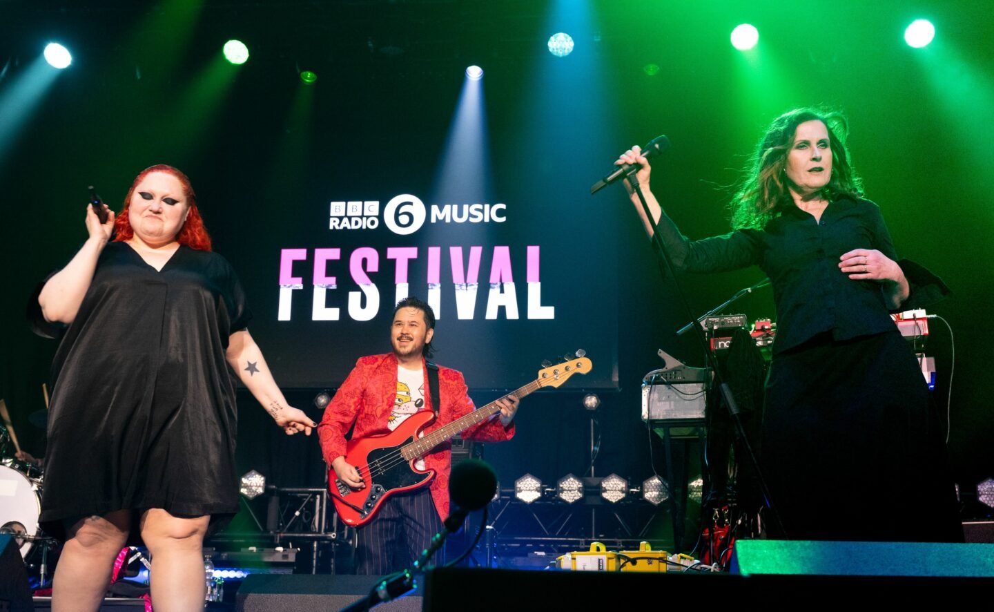 Beth Ditto performs in a hot pink dress onstage at BBC 6 festival with her band Gossip and Alison Moyet